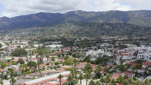 Rising Aerial Pan of Santa Barbara City with Palm Trees and Coastal Mountains alt