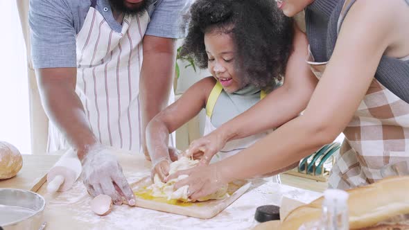 Close up of Happy African American family prepare dough together for cookie
