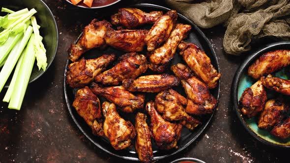 Grilled Spicy Chicken Wings Served with Tomato and Yogurt Dips Celery and Carrot