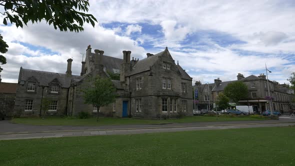 Stone buildings seen on a cloudy day alt