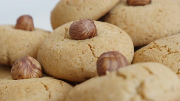 Panning on stacked baked biscuits with hazelnut   shallow DOF  4K 2160p 30fps UltraHD footage - Clos alt