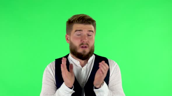 Man Claps His Hands with Dissatisfaction. Green Screen alt
