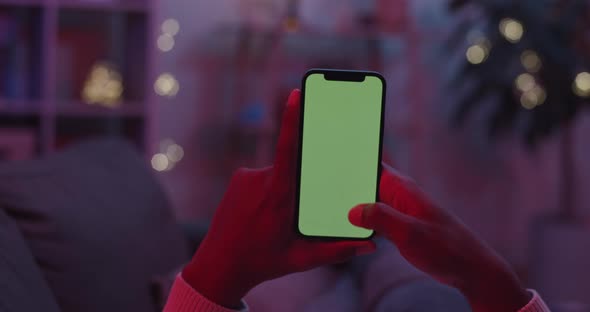 Man Scrolling with Finger on Chroma Key Screen of Smartphone alt