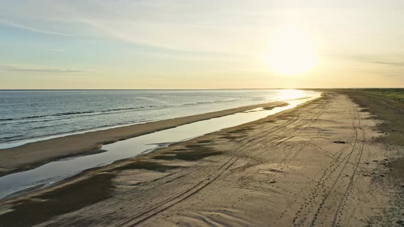 Heavenly Skies During Sunrise and the Peaceful Beach and Coast in Denmark alt