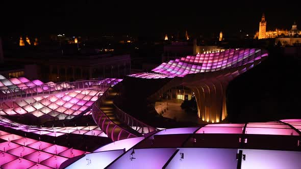 Magical nighttime illumination on the Setas de Sevilla. Aurora Experience and the skyline of Sevilla alt