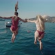 Two Girlfriends Jump From a Yacht Into the Water - VideoHive Item for Sale