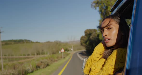 Young woman on a road trip in pick-up truck alt