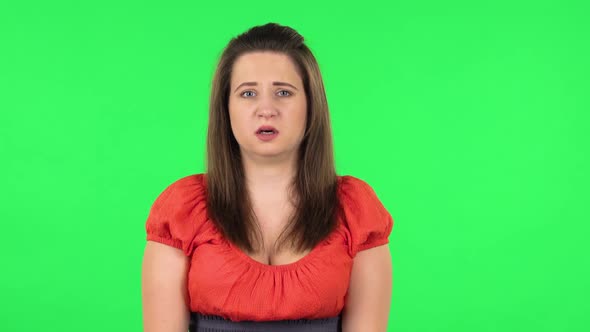 Portrait of Frightened Girl Says Wow with Shocked Facial Expression. Green Screen alt