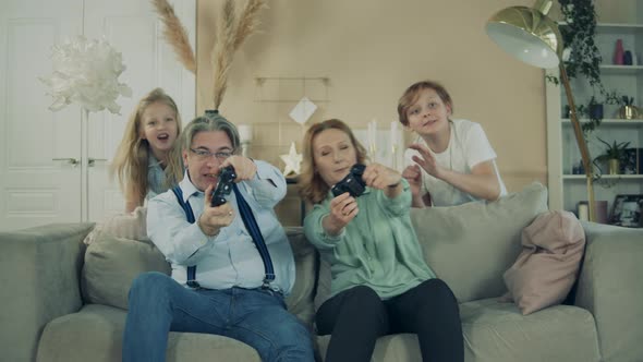 Granny and Granddad Are Playing Console and Grandkids Are Rooting for Them alt