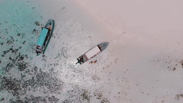 Anchored Pleasure Boats at Sandbanks in Ocean Tropical Island Zanzibar Aerial alt