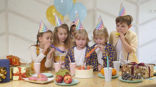 Caucasian Kids Celebrating Birthday at Home alt