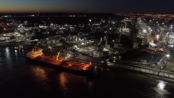 Aerial view power plant block. Water vapor rises to the sky. Power poles and chimneys in the backgro alt