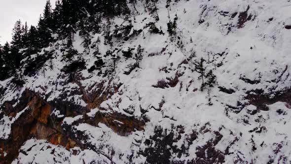 Mountain cliff and couloir reveal close up in winter alt