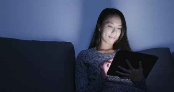 Woman use of digital tablet computer at home  alt