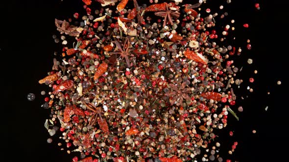 Super Slow Motion Shot of Flying and Rotating Colorful Mix Spices at 1000Fps alt