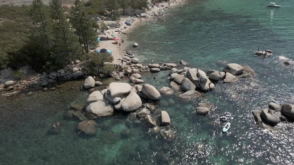 Rocks on the Crystal Clear Lake Aerial Footage alt