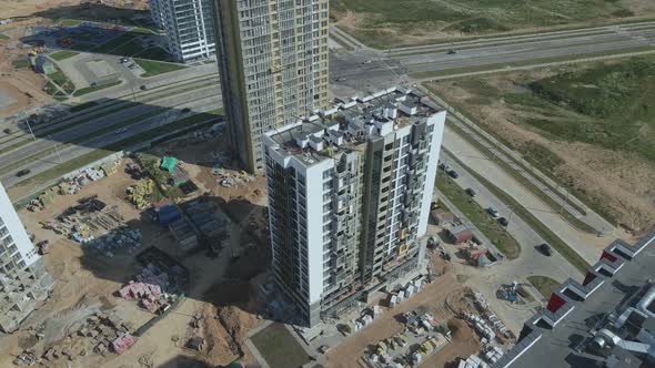 Construction site for a new city block. Construction work is underway. alt