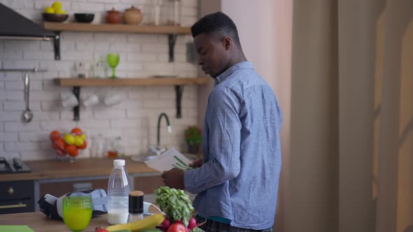Live Camera Follows Young Confident African American Serious Man with Business Graph Walking in alt