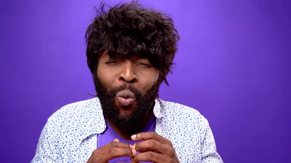 Shocked Amazed Young Bearded Black African American Man Purple Background alt