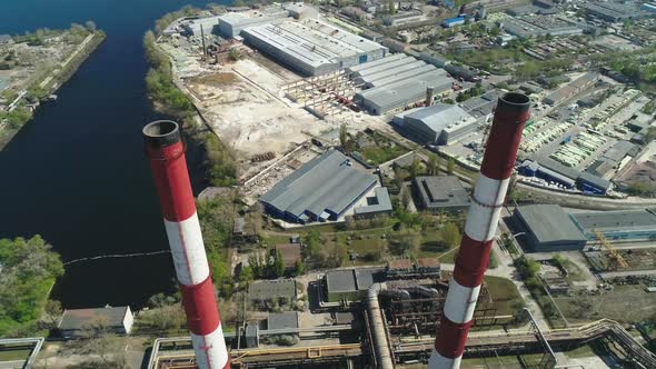 Aerial Drone View of Large Red and White Chimney Without Smoke at Sunny Day