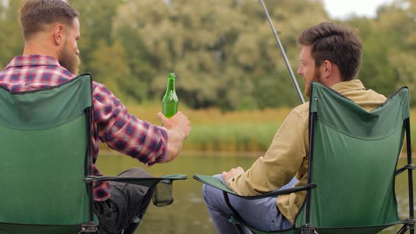 Happy Friends Fishing and Drinking Beer on Lake 39 alt