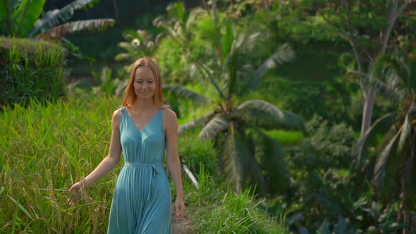 Slowmotion Shot of a Young Woman in a Blue Dress Visits Famous Tegalalang Rice Terraces in alt