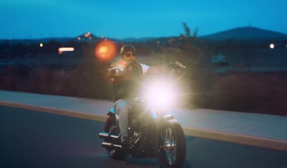 Man on a Motorbike at Night alt