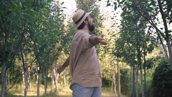 Satisfied Excited Handsome Man Enjoying Connection with Nature and Showing Thumbs Up Looking at alt