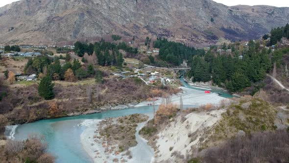 Aerial wide shot of Skippers canyon and Shotover River with view of Edith Cavell Bridge in Queenstow alt