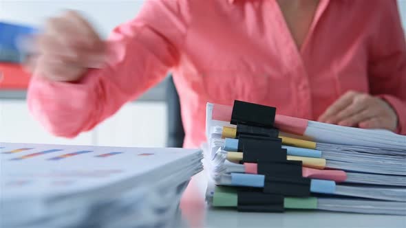 Businesswoman Working In Stacks Files