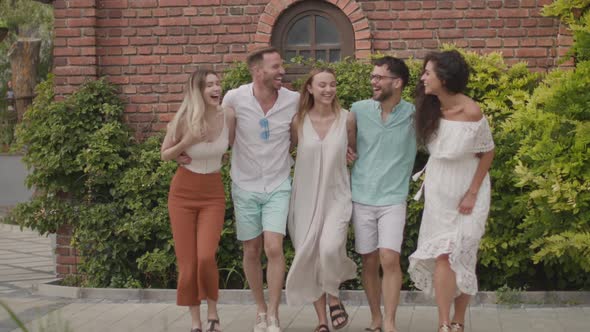 Group of happy young people having fun outdoors