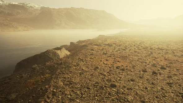 Atmospheric Landscape with Mountain Lake Among Moraines in Rainy Weather alt