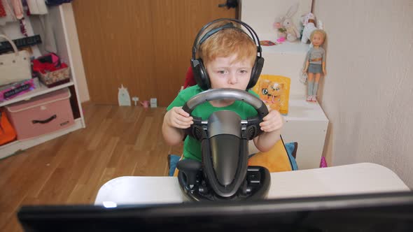 Boy Playing Races On Computer alt