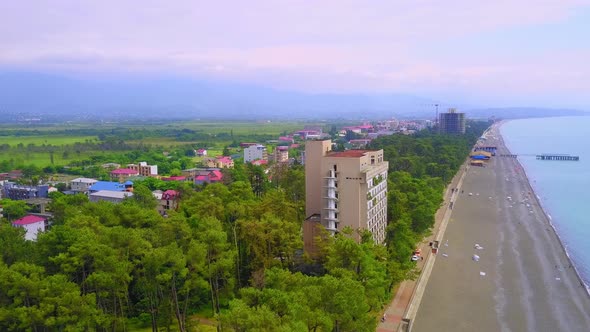 View from drone to beach along sea with green vegetation. Georgia. Kobuleti. alt