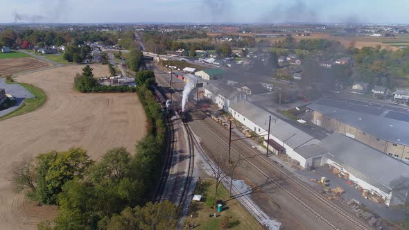 Multiple Antique Restored Steam Engines in a Train Yard alt
