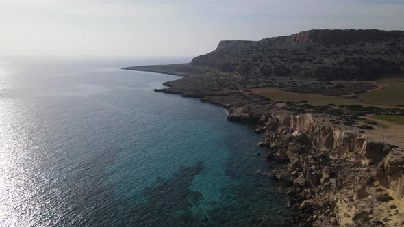 Mediterranean Sea. Flight of the camera over the mountains and the sea. Steep rocky cliff. Cyprus