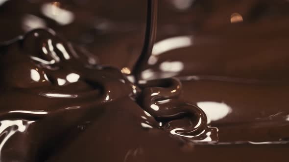 Chocolate. Pouring Melted Liquid Premium Dark Chocolate. Close Up of ...