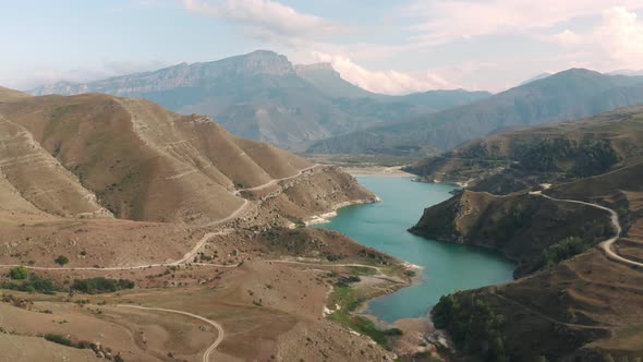 Picturesque Gizhgit Blue Lake in Mountain Valley on Summit Landscape. Drone Shooting Amazing Lake alt