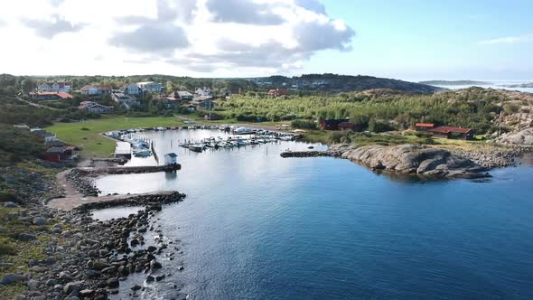 Aerial Drone Shot of A Small Marina at The Ocean Coastline on The West Coast of Sweden