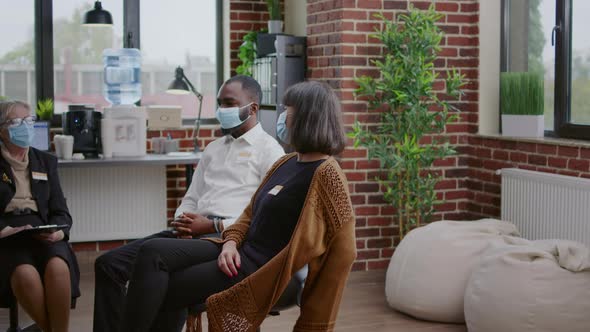 Woman Talking About Alcohol Addiction Problems with Group of People at Aa Meeting alt