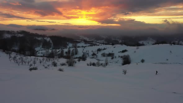 Snowboarder on the Hills