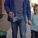 Close View of the Dad with Son Holding the Plastic Bottle and Put It Into the Special Garbage Bin - VideoHive Item for Sale