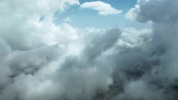 Cloudy landscape high in the mountains aerial view 4 K alt