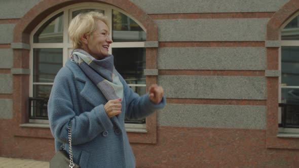 Meeting of Two Mature Adult Female Friends Outdoors alt