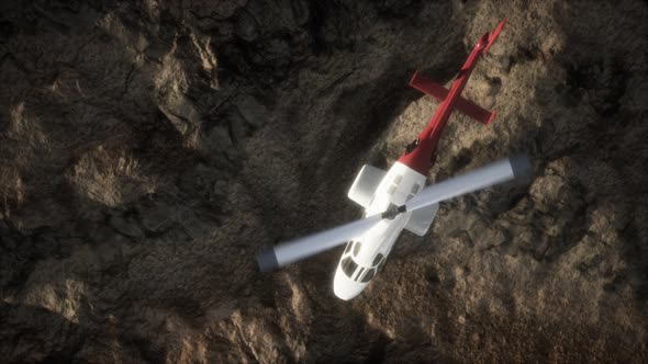 Slow Motion Helicopter Above Rocky Desert alt