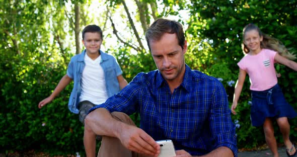 Kids playing with their father in park, Stock Footage | VideoHive