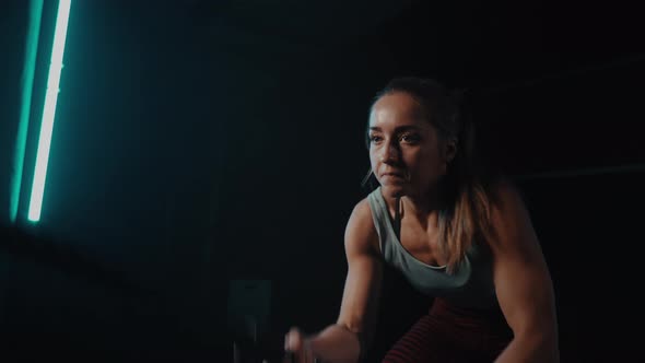 Young Girl Training with Battle Rope in Sport Gym on Battle Ropes Session alt