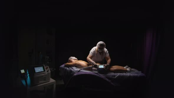 Woman Getting Cryolipolysis Antifat Anticellulite Freezing Treatment Procedure in Spa Salon alt