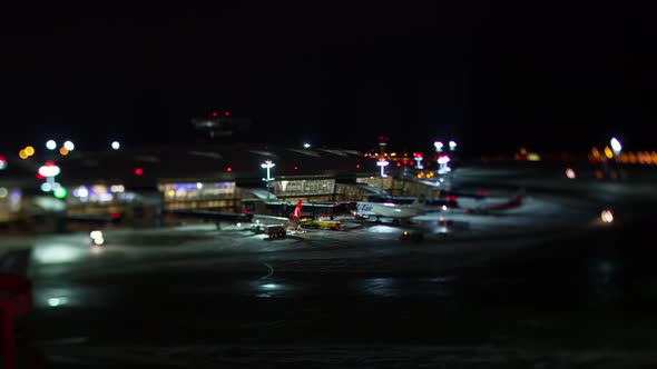 Timelapse of maintaining and boarding planes Vnukovo Airport at winter night alt