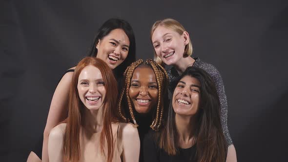Portrait of Five Smiling Laughing Beautiful Women in Bodysuit Standing Together alt